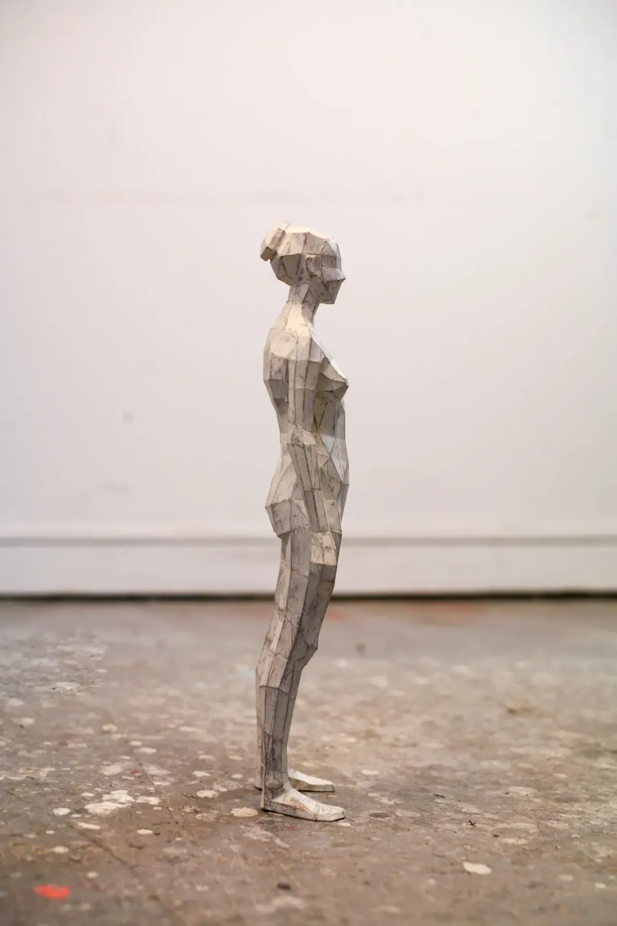 Sculptures made out of folded paper inspired by the 3D characters created in video games