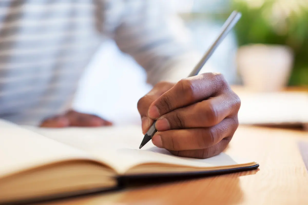 What causes some people to be left-handed, and why are fewer people left- handed than right-handed?