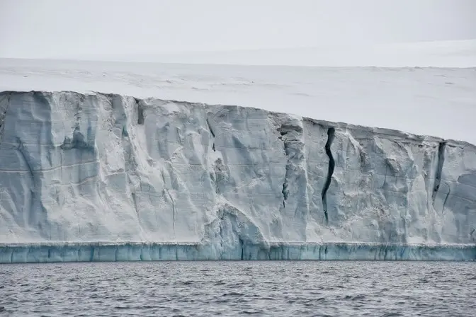 Glacier cliffs break into sea faster than predicted, but restabilize
